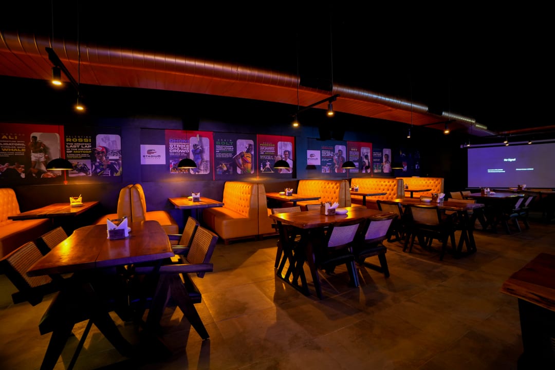 Guests seated at booth tables during a live screening