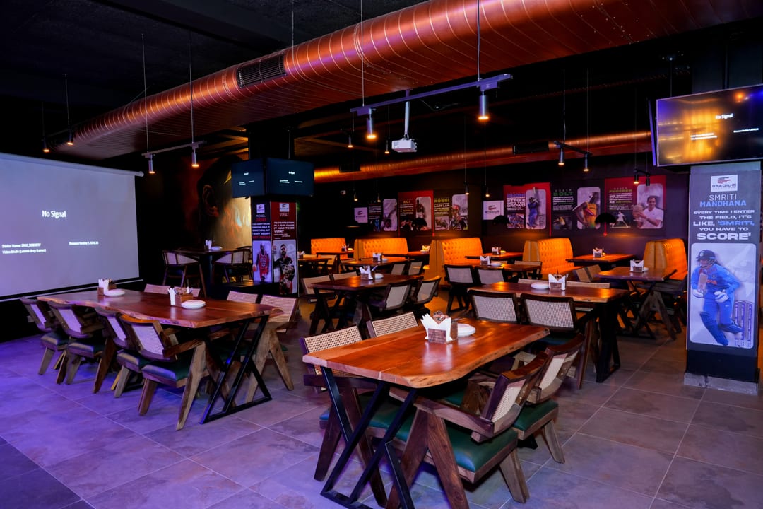 Dining area with sports memorabilia wall art