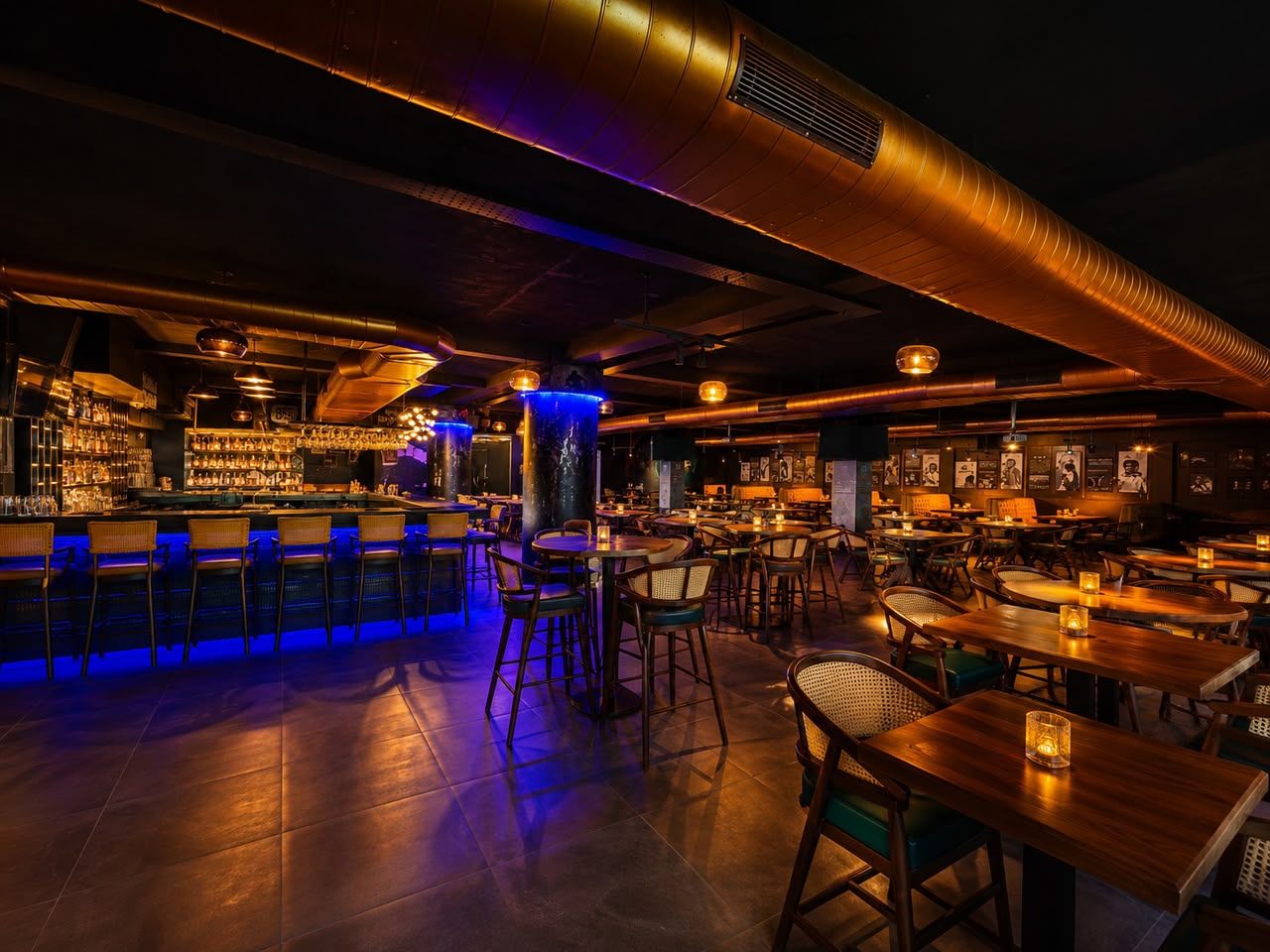 Lounge seating area with neon signage and blue accent lighting