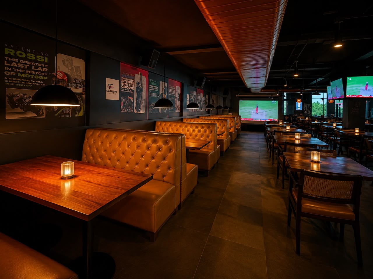 Sports-themed dining hall with cane chairs and match screenings